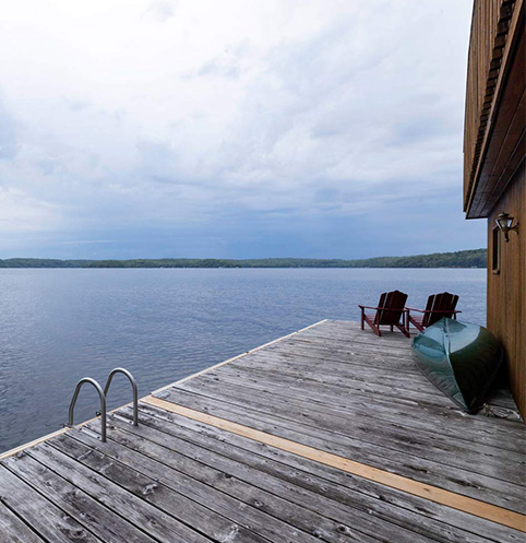 dock and chairs on the water